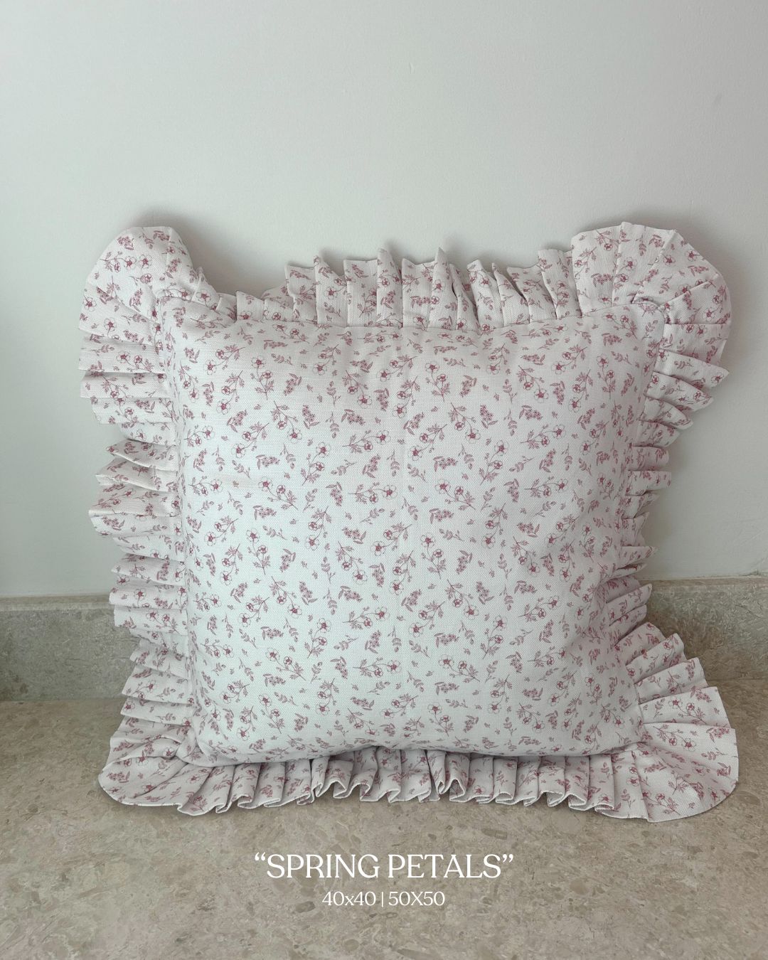 Vintage countryside-inspired pink cushion with frill edge