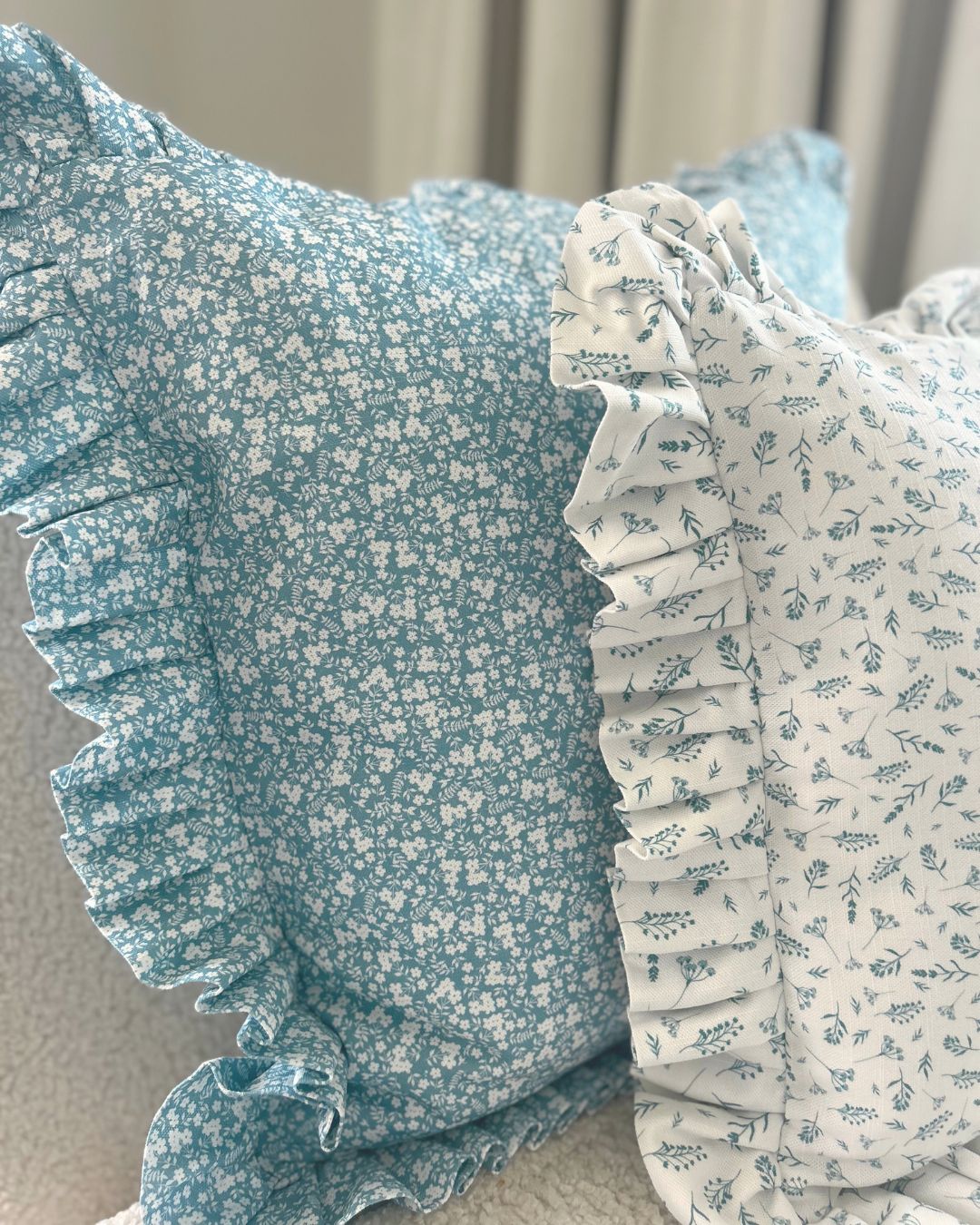 Vintage countryside-inspired blue cushion with frill edge