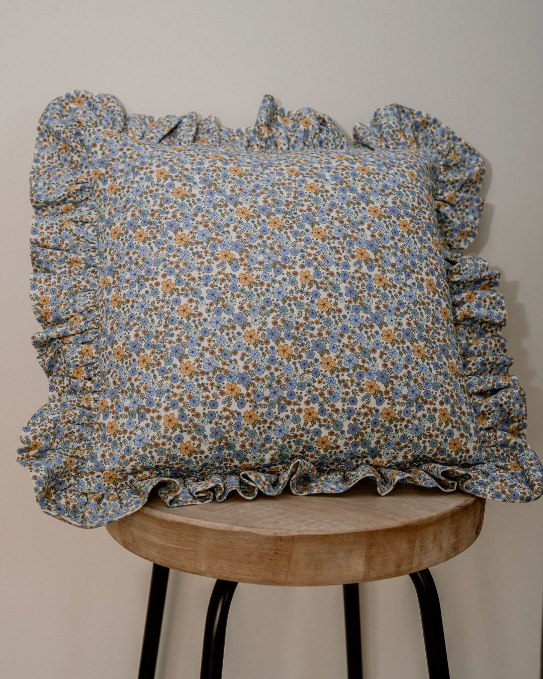 Blue ditsy floral frill cushion for nursery in Dubai